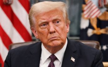 Trump signing executive order at desk