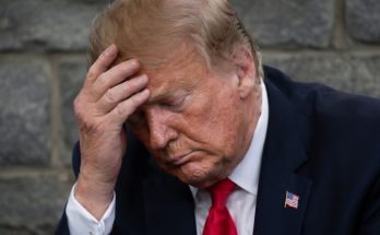 Donald Trump standing silently in Washington