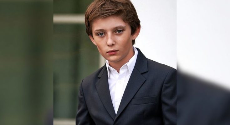 Barron Trump standing quietly