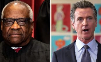 Trump walking with folder outside White House