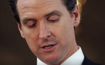 Gavin Newsom speaking amid political scrutiny