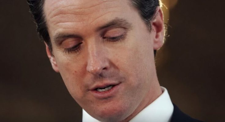 Gavin Newsom speaking amid political scrutiny