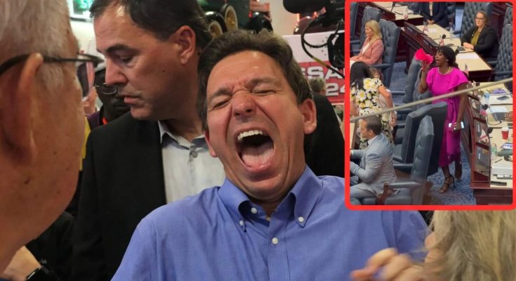 man laughing energetically in a crowded event with a woman speaking passionately