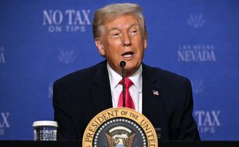 political figure speaking in a news photo