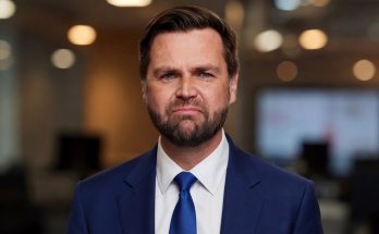 emotional businessman in blue suit with tears in office setting