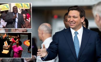 politician greeting supporters amid voting map protests