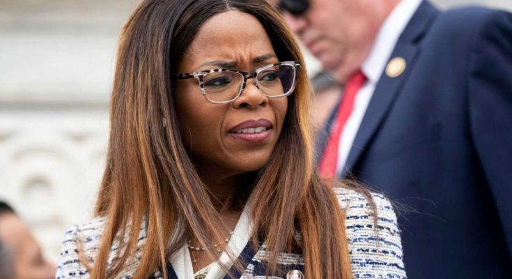 concerned woman in glasses outdoors, formal setting