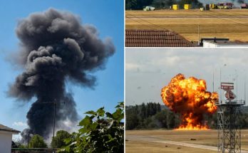 explosive smoke clouds rise over airfield with emergency response