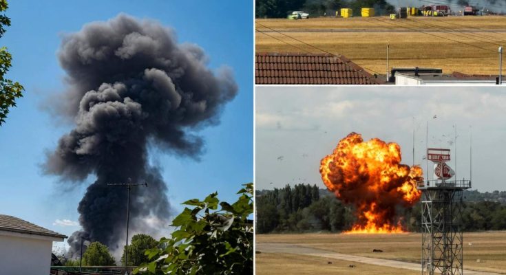 explosive smoke clouds rise over airfield with emergency response