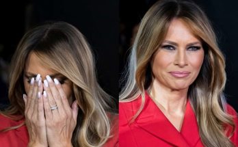 melania Trump wearing a red double-breasted coat, shown covering her face with manicured