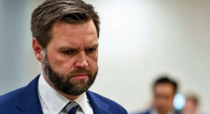 serious man in blue suit focused in office setting