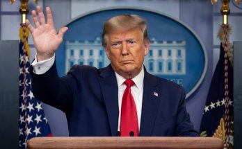 donald Trump raises hand at White House podium with Breaking News banner and arrest