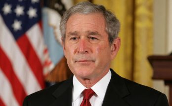 man in suit with tears in eyes, emotional moment indoors