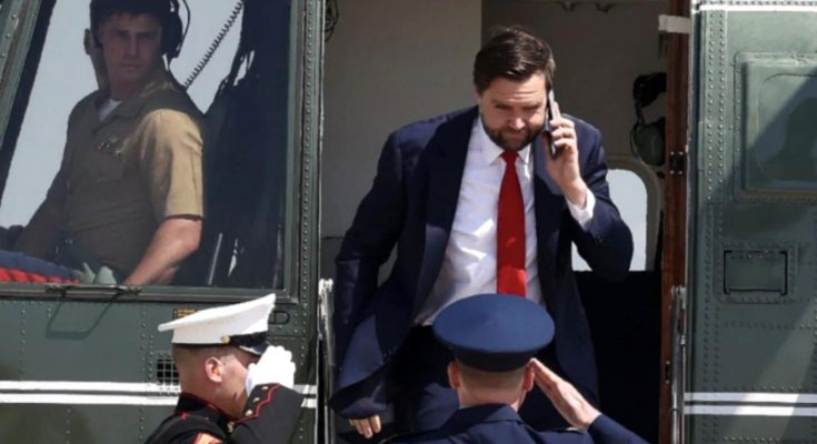 JD Vance exits Marine One helicopter while on phone call as uniformed Marines salute