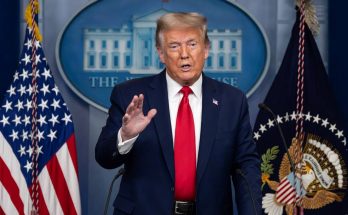 political figure speaking in a news photo