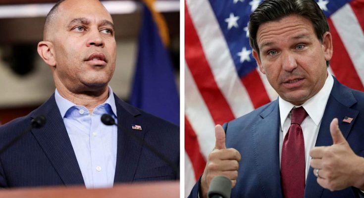 political leaders speaking at press conference with flags behind them