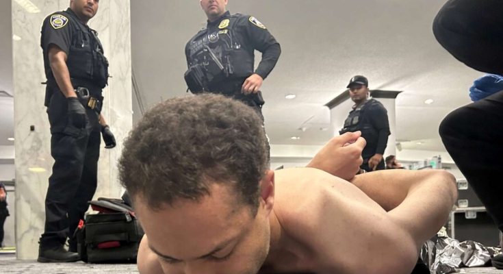 arrest scene at airport with police officers present