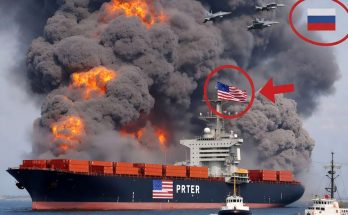 burning container ship with American flag, Russian jets overhead, inset shows damaged
