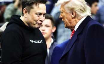 two prominent figures in intense discussion at public event