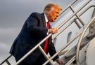man in suit climbing airplane stairs under cloudy sky, focus on travel
