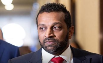 kash Patel in dark suit and red tie with headline text 'See You In Court' overlay