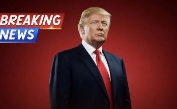 prominent figure in red tie with Breaking News banner