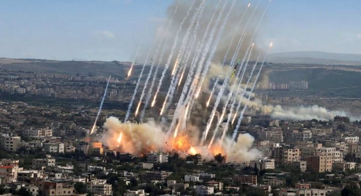 rockets and explosions over city skyline during conflict