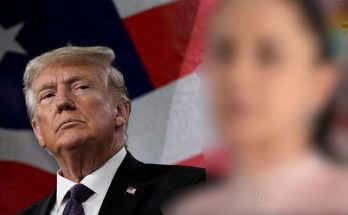 political leader against USA flag background, serious expression