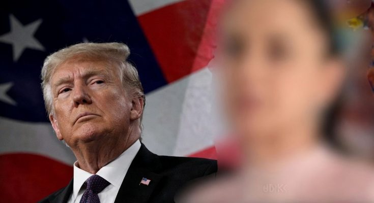 political leader against USA flag background, serious expression