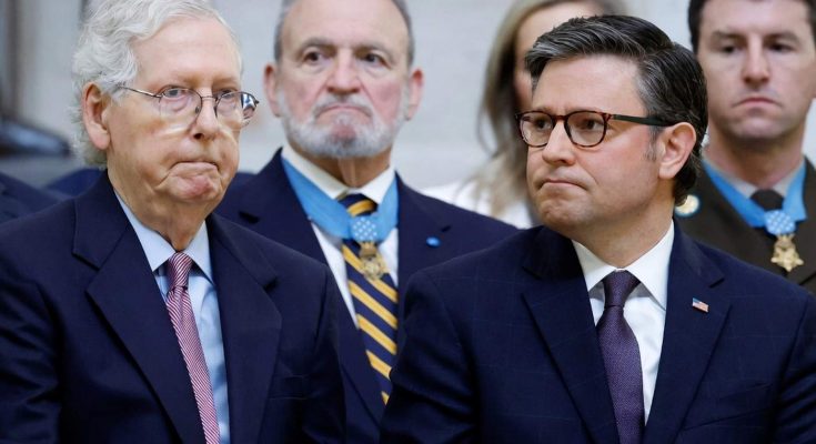 speaker Mike Johnson and Mitch McConnell seated together during formal event with Medal