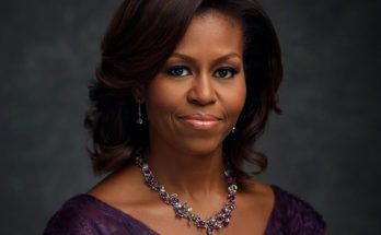 michelle Obama official portrait wearing purple lace dress and ornate gemstone necklace