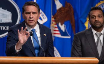 two men at DOJ podium with bold text overlay announcing Trump's new Attorney General