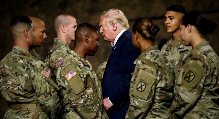 president meeting soldiers in military uniforms indoors