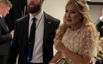 elegant couple in formal attire at a glamorous event