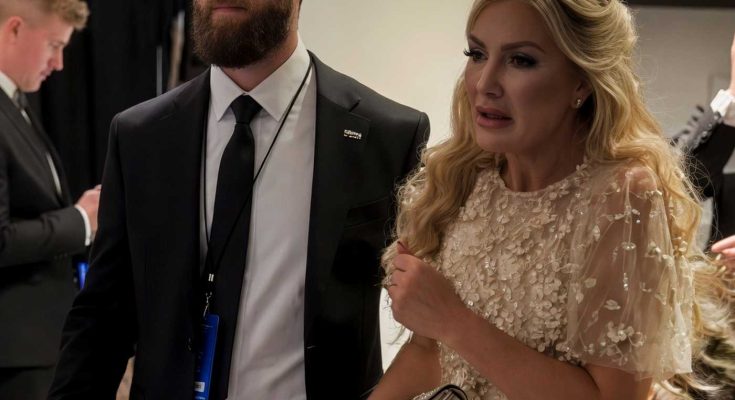elegant couple in formal attire at a glamorous event