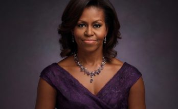 elegant woman in purple dress with necklace, studio portrait