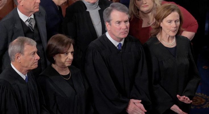 judges in formal robes standing in courtroom during a session