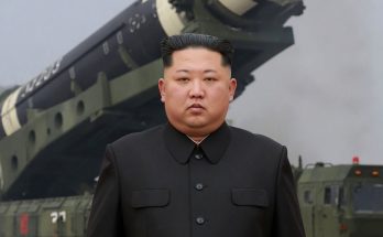 political figure speaking in a news photo