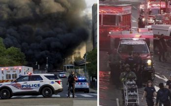 emergency vehicles respond to massive fire downtown with thick smoke