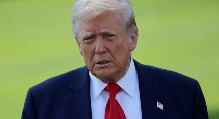 serious man in suit with red tie, outdoors setting