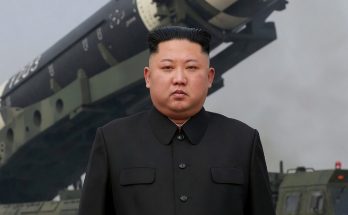 kim Jong Un stands before Hwasong-15 intercontinental ballistic missile on mobile launcher