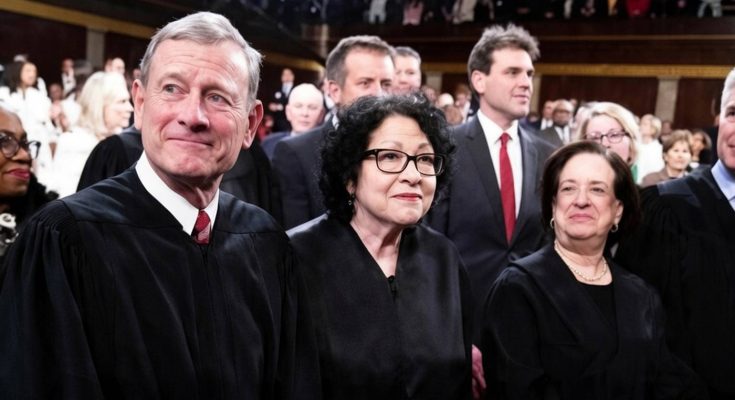 judges gathered at a formal event, wearing black robes
