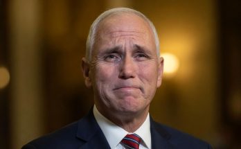 political figure speaking in a news photo