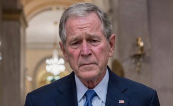 serious man in suit in elegant hallway