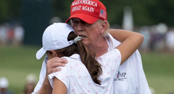 donald Trump in red MAGA cap embraces female golfer in white outfit on green course