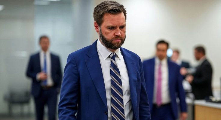 businessman in blue suit walking in office, serious expression