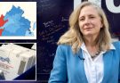 virginia Representative Abigail Spanberger in blue blazer with electoral map and mail