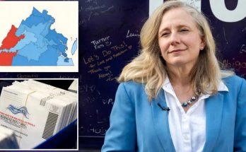 virginia Representative Abigail Spanberger in blue blazer with electoral map and mail