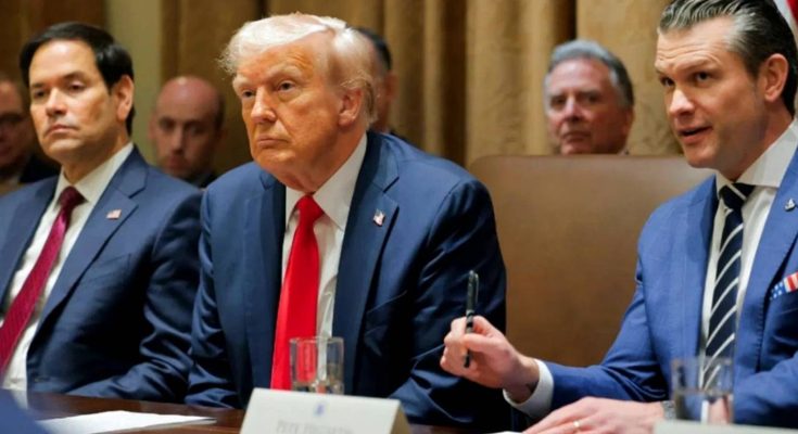 donald Trump seated at conference table with Marco Rubio and Pete Hegseth during cabinet