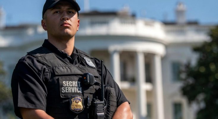 secret Service agent stands alert outside White House during security lockdown with press